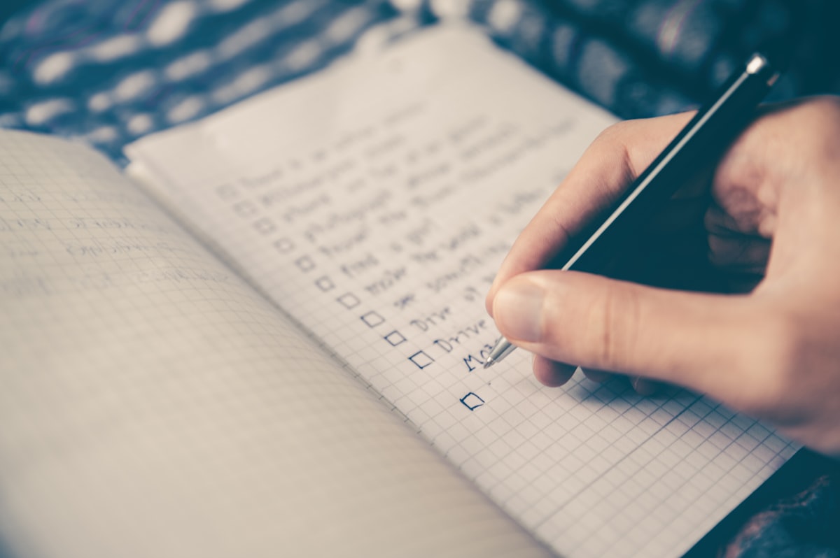 An organized desk with a calendar and office supplies for editorial planning