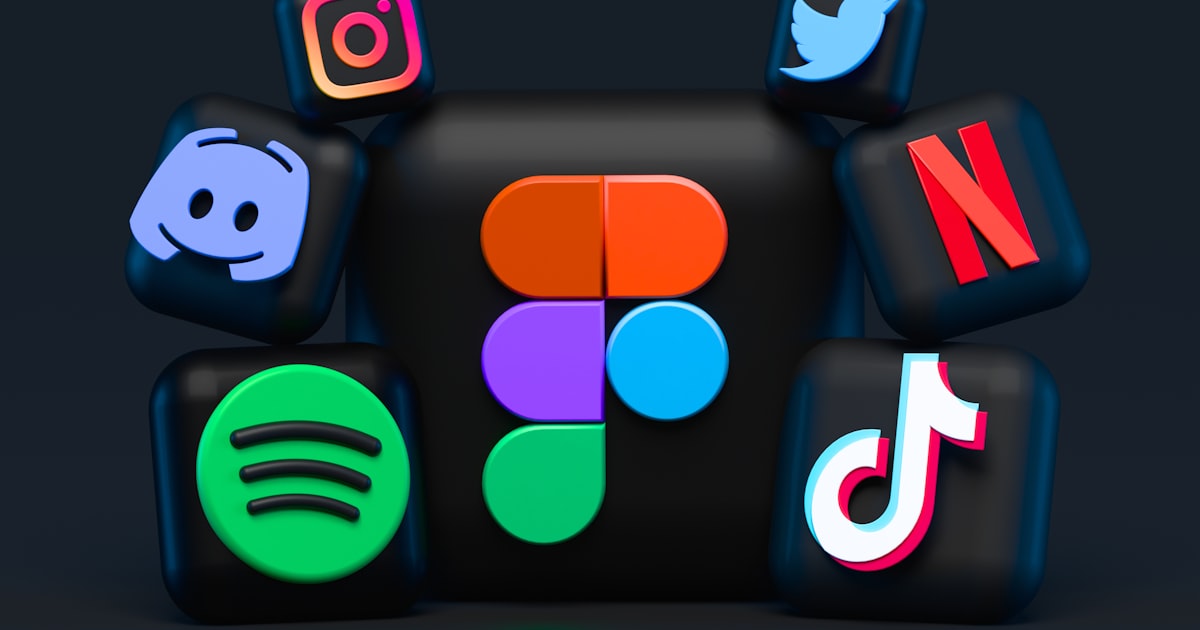 Hands holding a smartphone displaying social media feeds and messaging apps