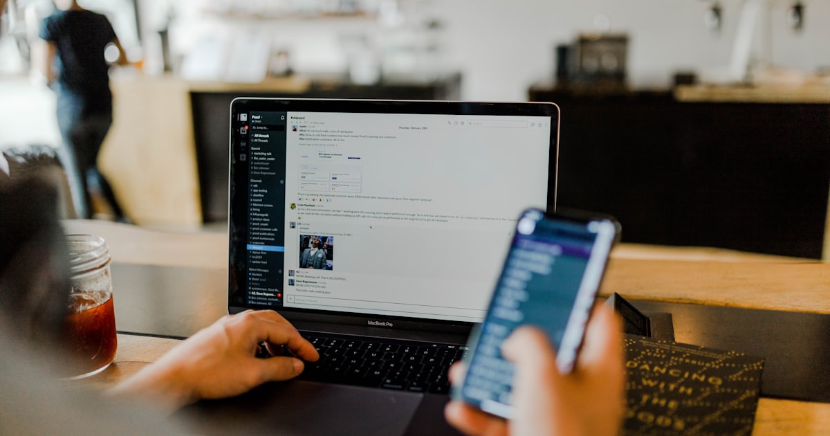 Person scrolling through a social media feed on a mobile phone
