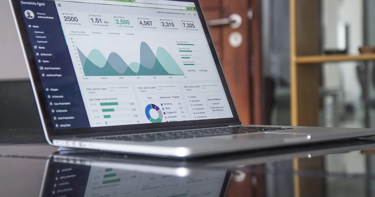 Marketing analytics dashboard displaying social media performance metrics on a laptop screen