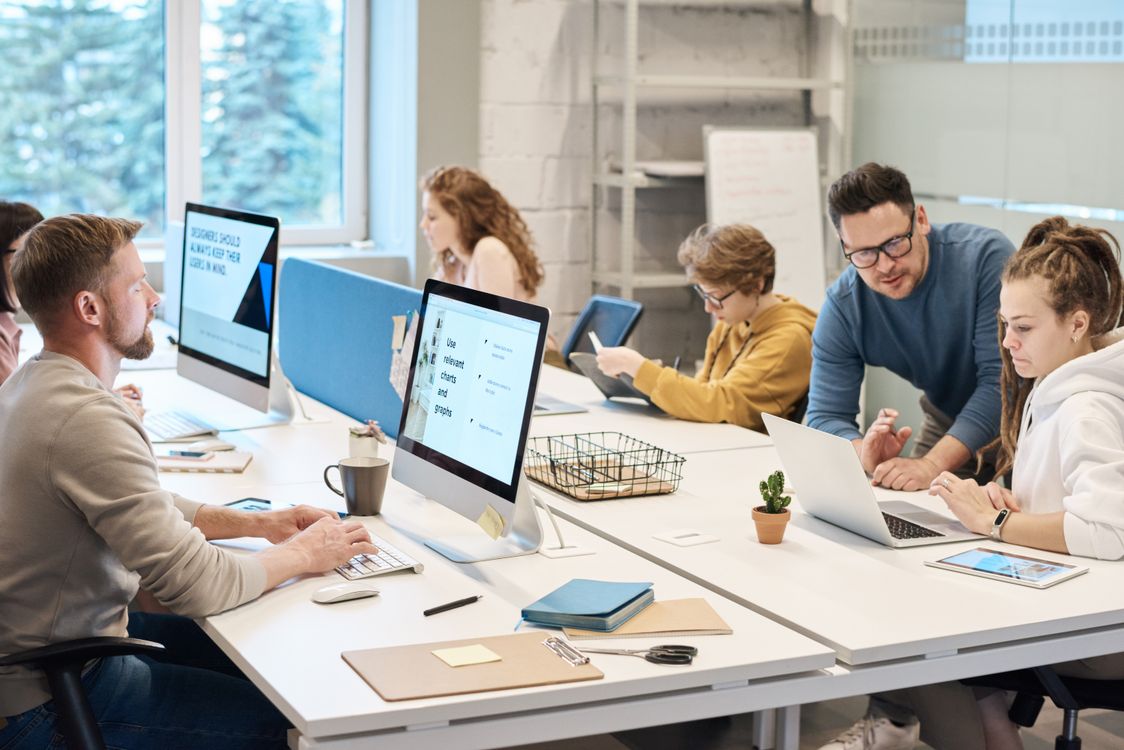 Support professionals responding to customers in a modern office