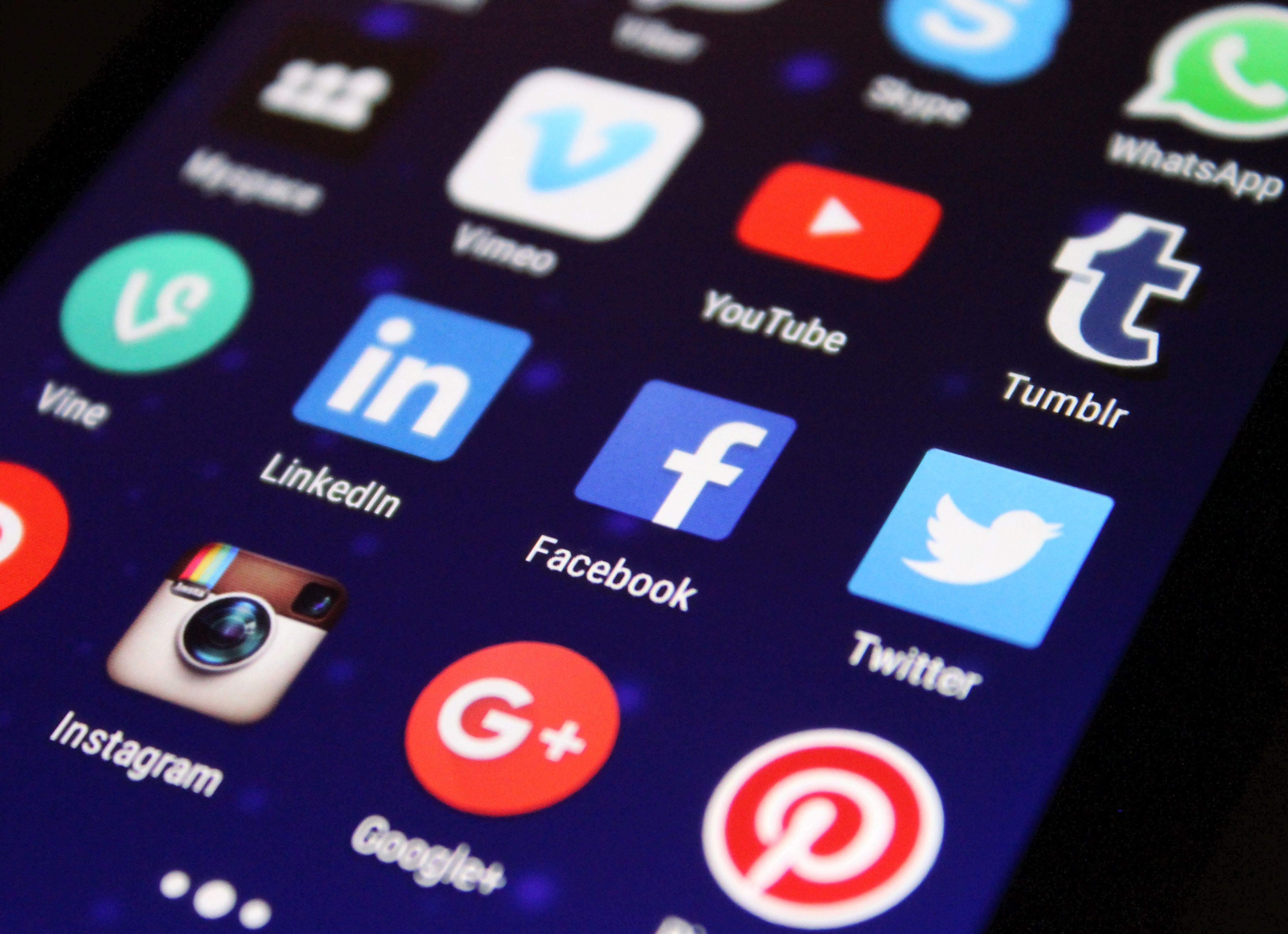 Smartphone showing social media app icons including Instagram