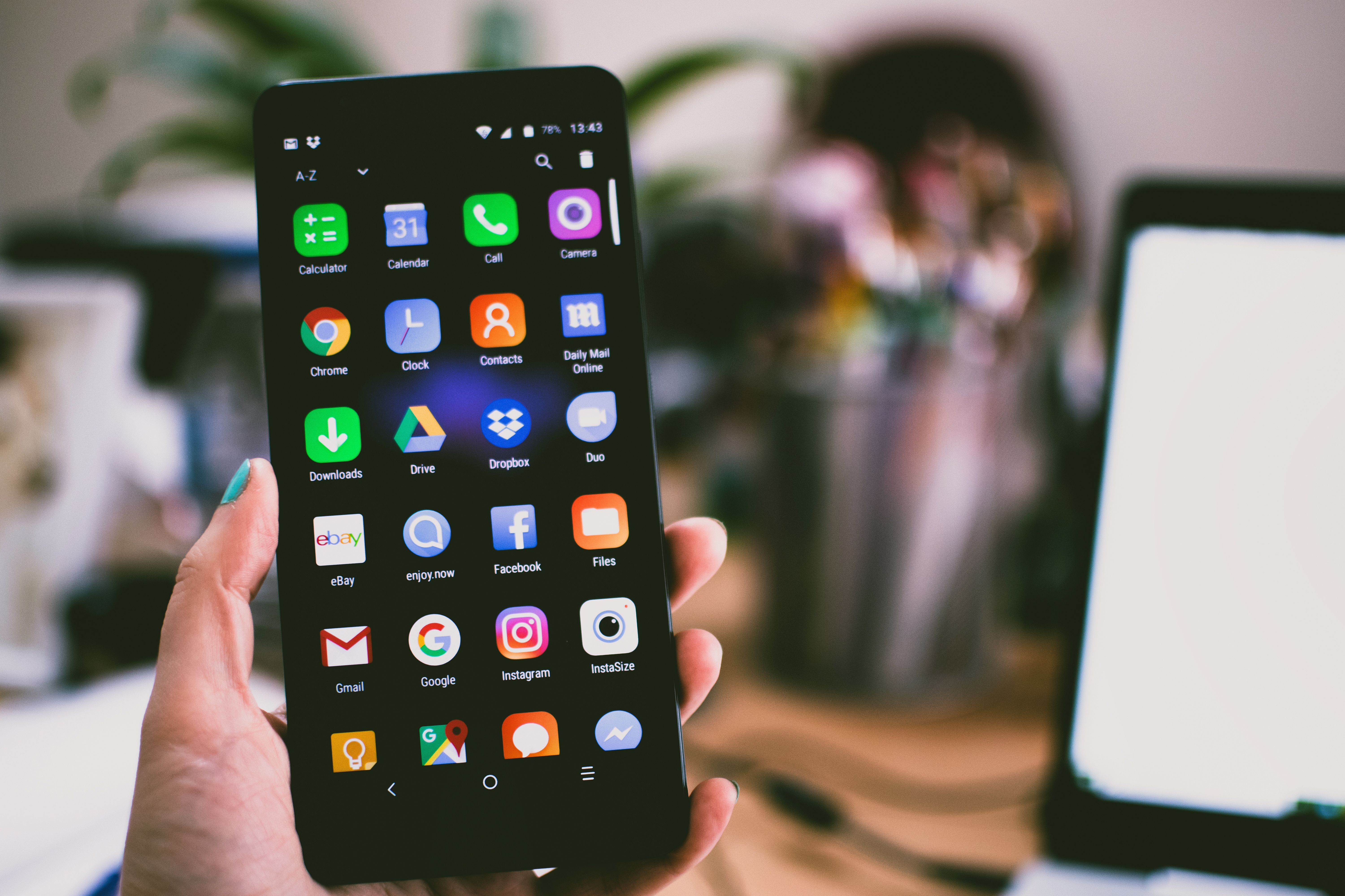 Person managing social media on a smartphone