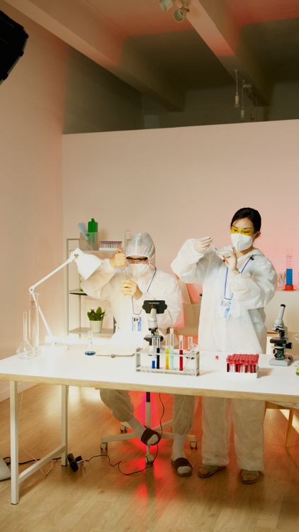 Scientists conducting chemical experiments with test tubes in a modern research laboratory.