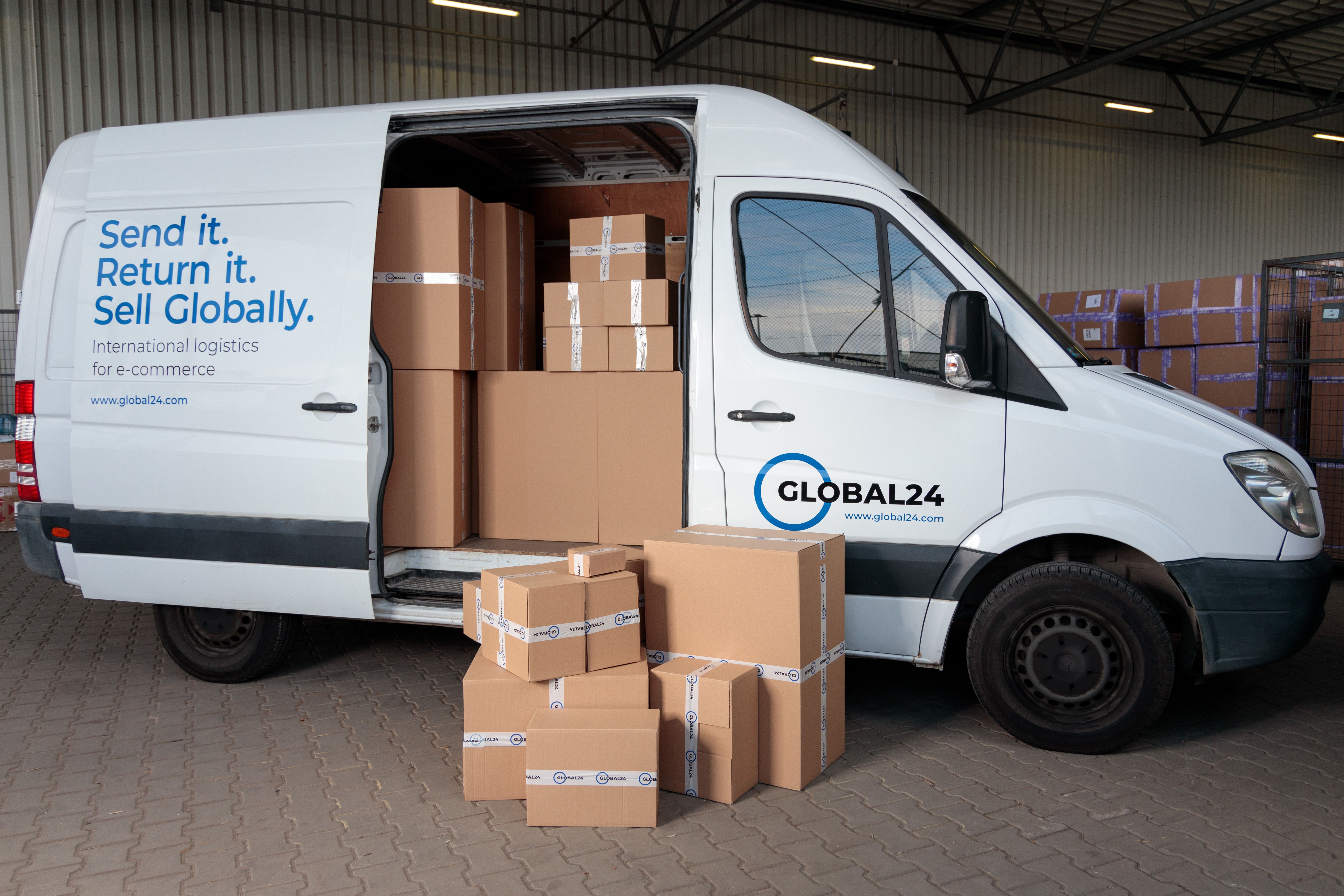 Cardboard boxes loaded in a delivery truck inside a warehouse for shipping logistics