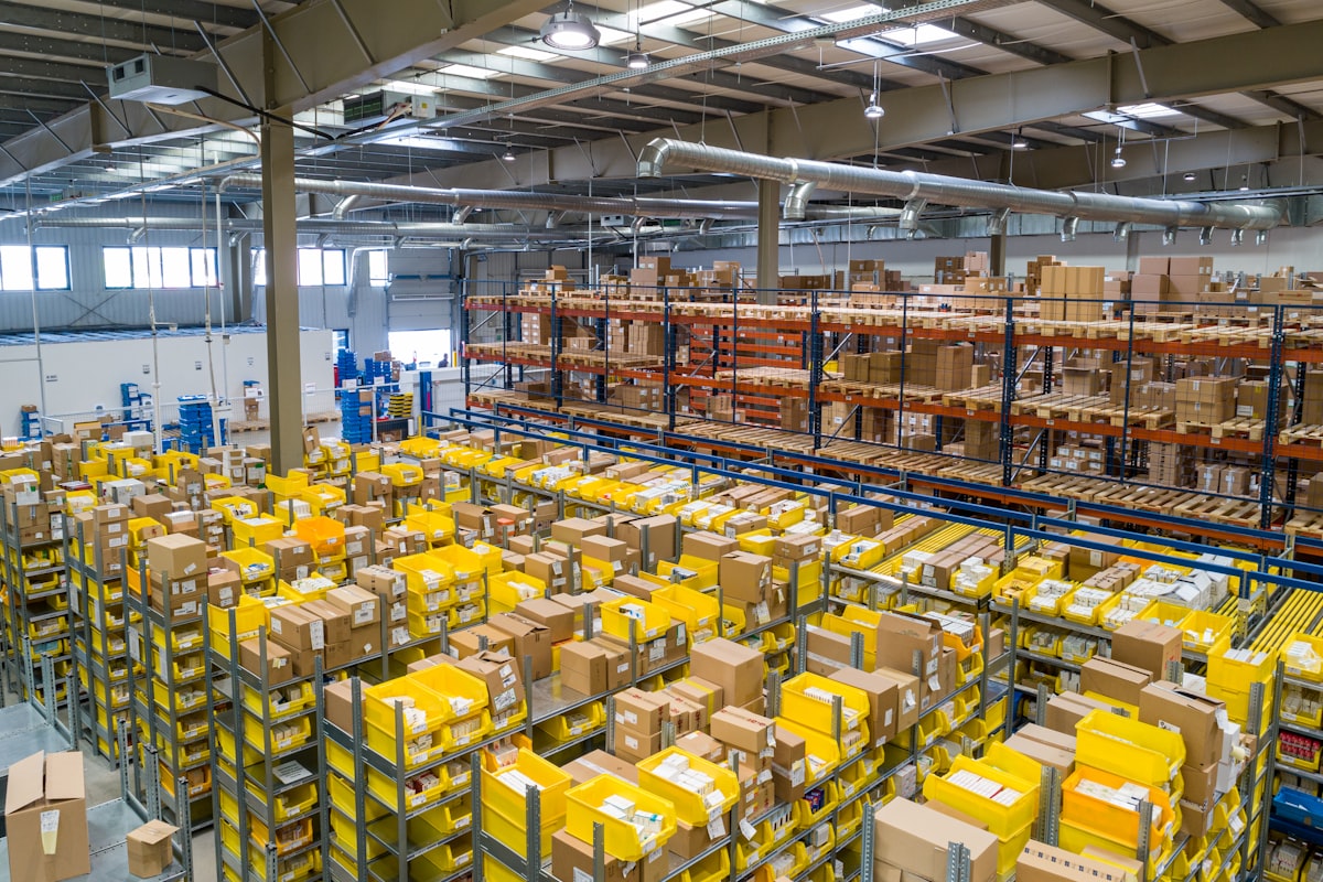 Warehouse shelves stacked with cardboard boxes ready for distribution