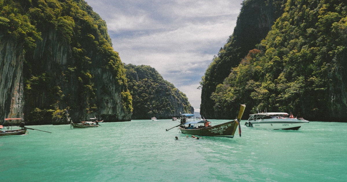 Aerial view of turquoise water and tropical islands in Thailand's Andaman Sea