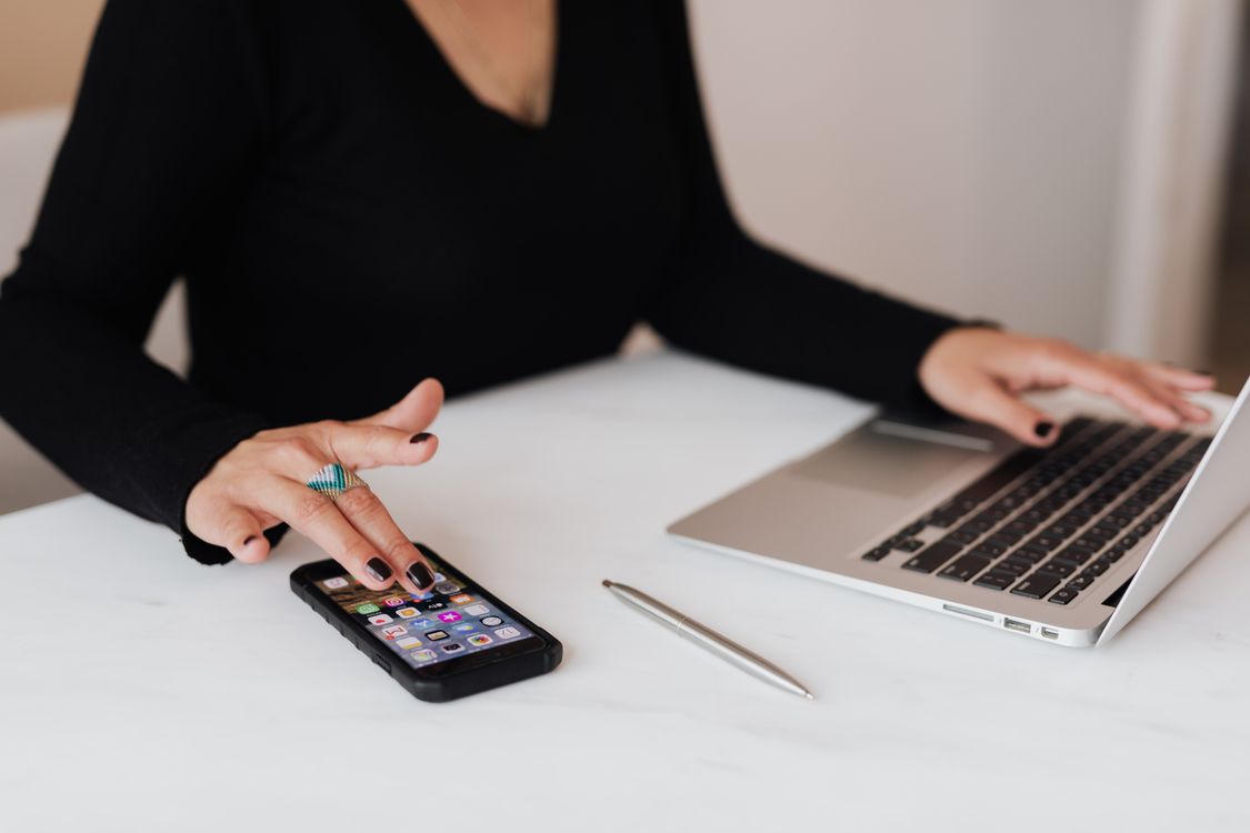 Social media manager working at an office desk