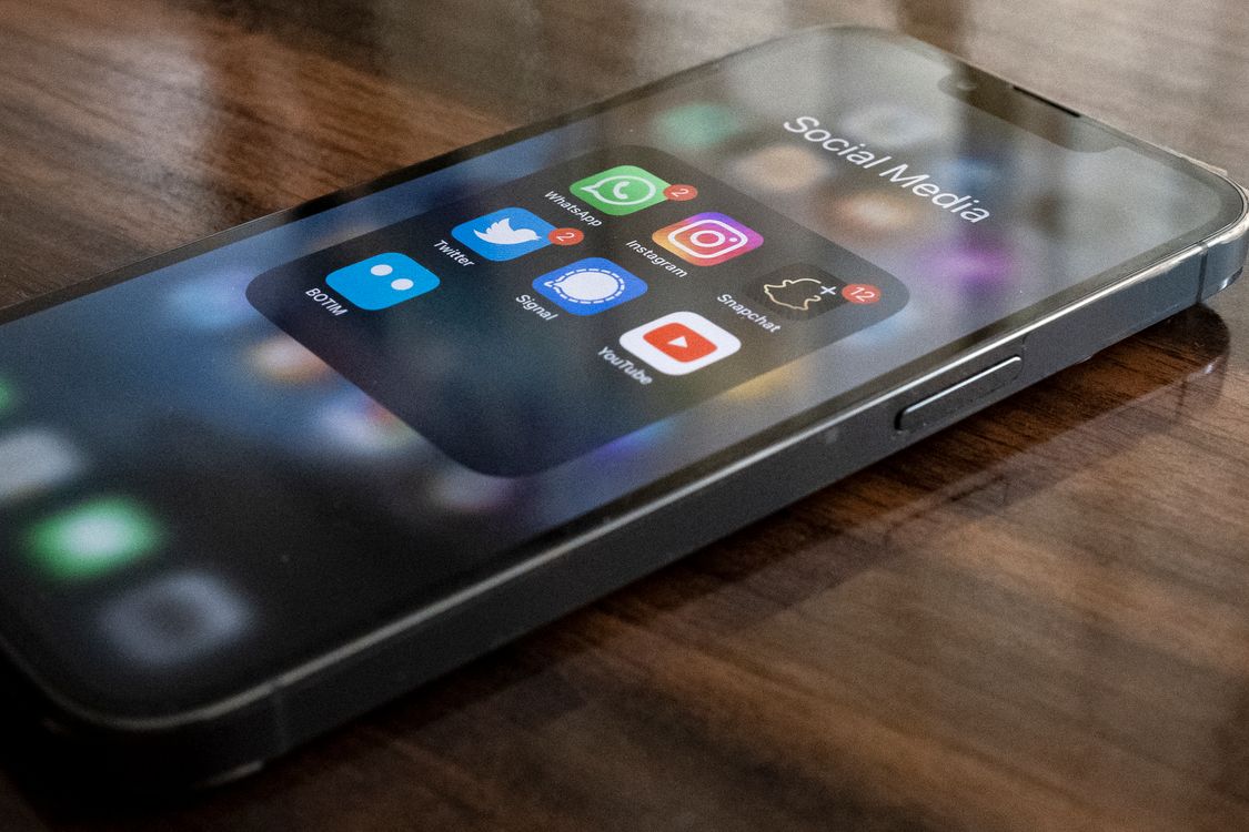 Close-up of a smartphone displaying social media app icons