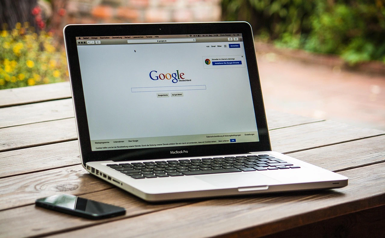 Laptop workspace used for managing social media and marketing tasks