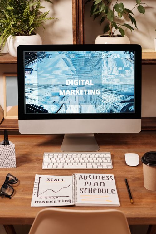 Business schedule and planning notes written in a notebook on a desk
