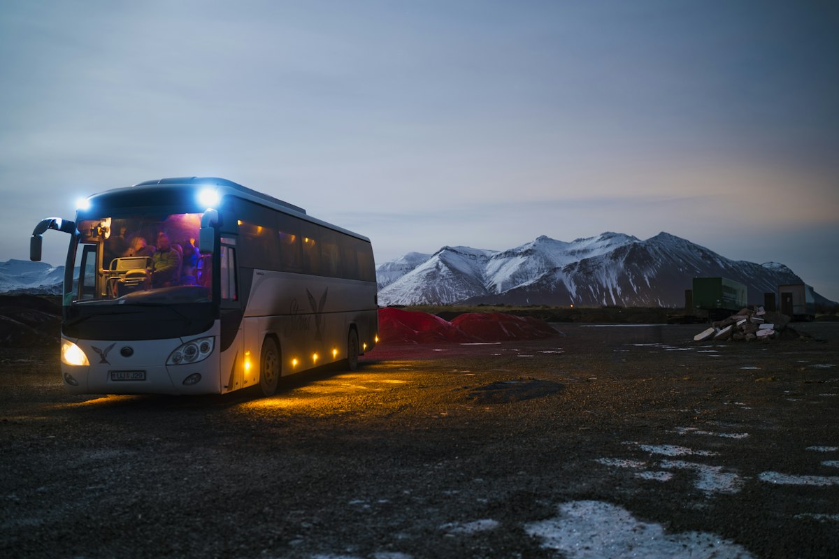 White passenger shuttle bus ready for airport transfer service
