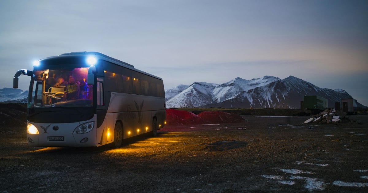 Modern passenger coach on the road representing shuttle transport operations