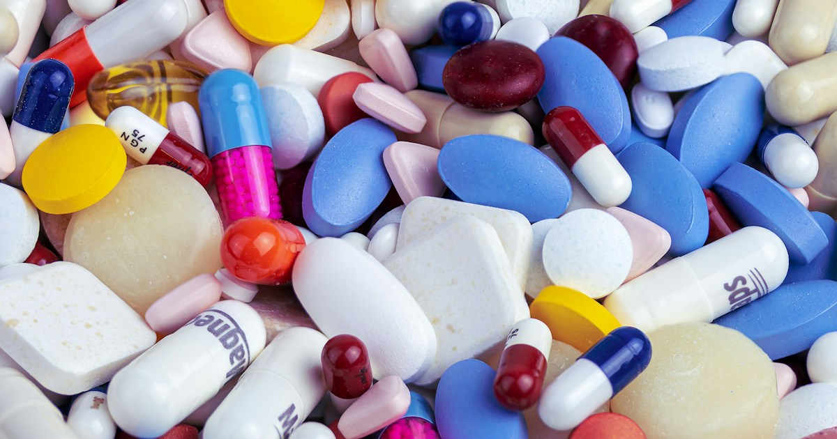 Probiotic supplement capsules on a light surface