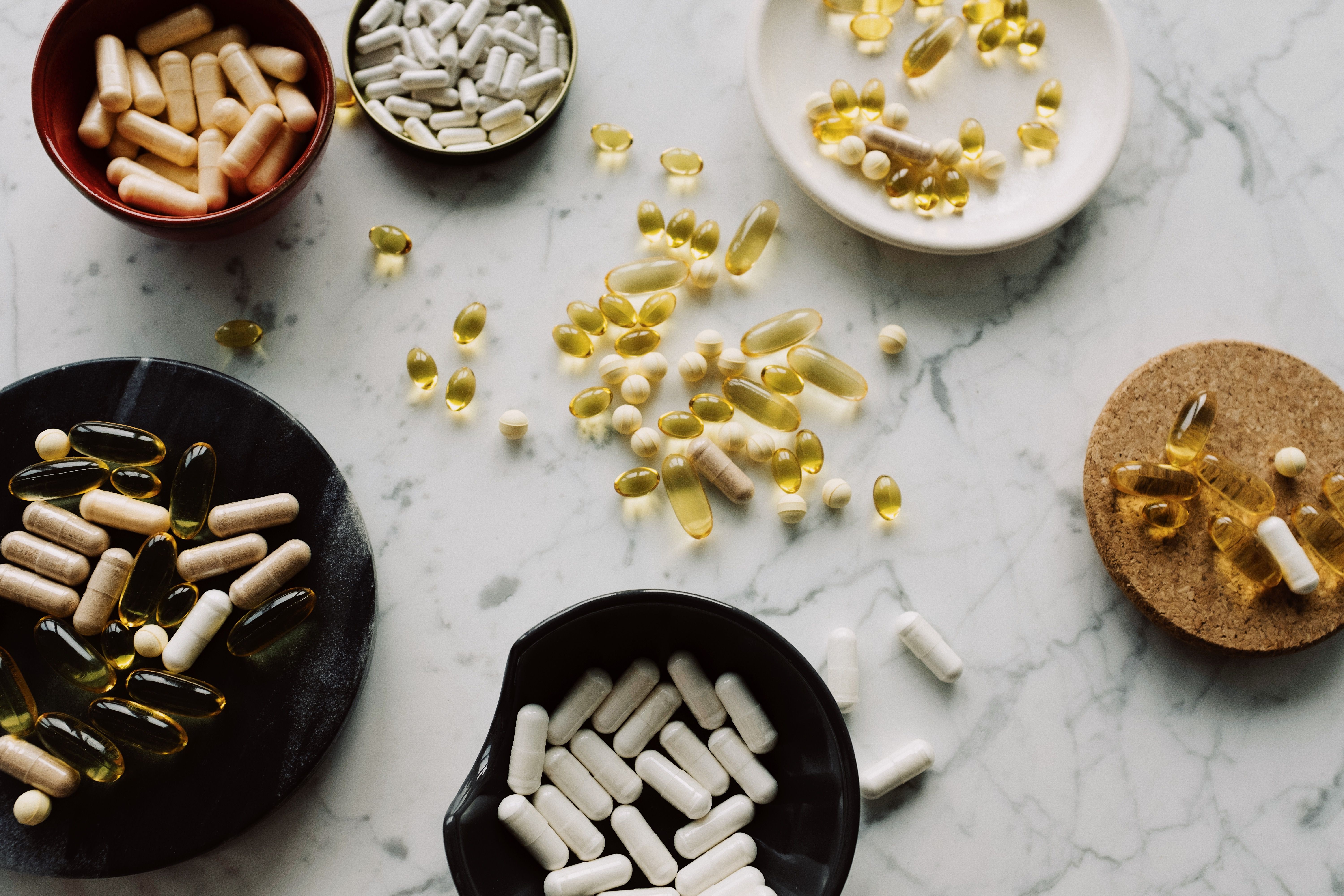 Glass of water and supplements on a table during a morning routine