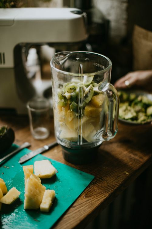 Fresh fruit in a blender jar ready for a smoothie