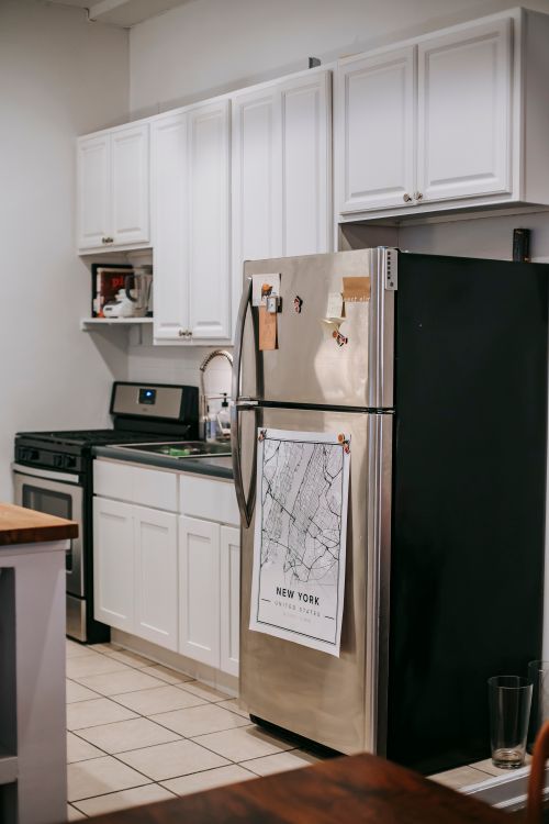 Modern compact kitchen with built-in stainless steel appliances