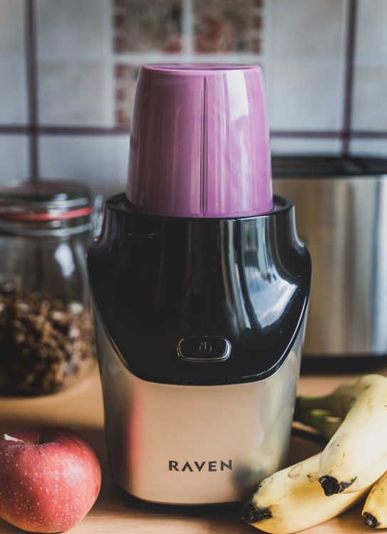A countertop blender on a clean kitchen surface