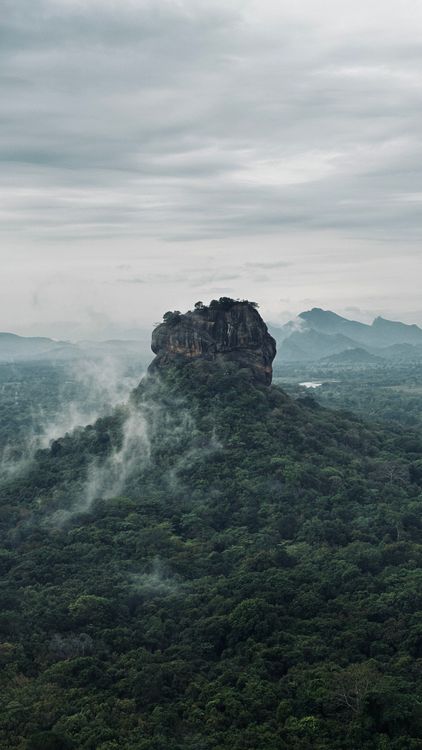 Aerial view of Sigiriya Rock Fortress surrounded by forest