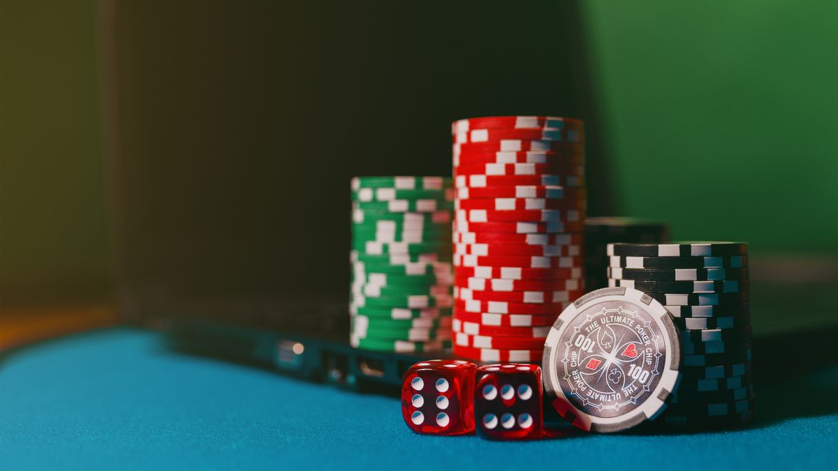 Dice and casino tokens displayed on a table representing online gambling