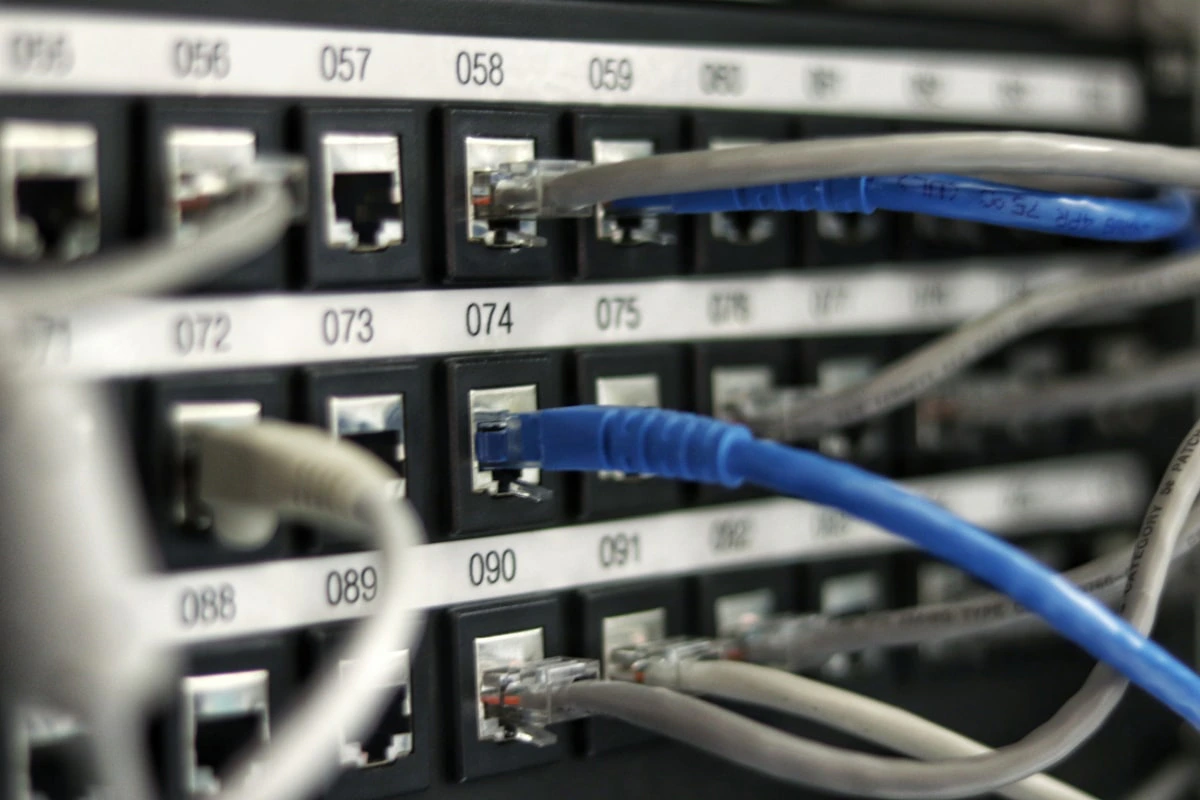 Rows of server racks with status lights in an enterprise data center