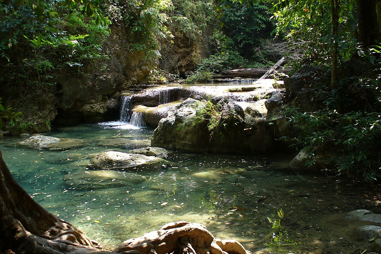 Turquoise pool beneath Erawan Falls in Kanchanaburi, Thailand