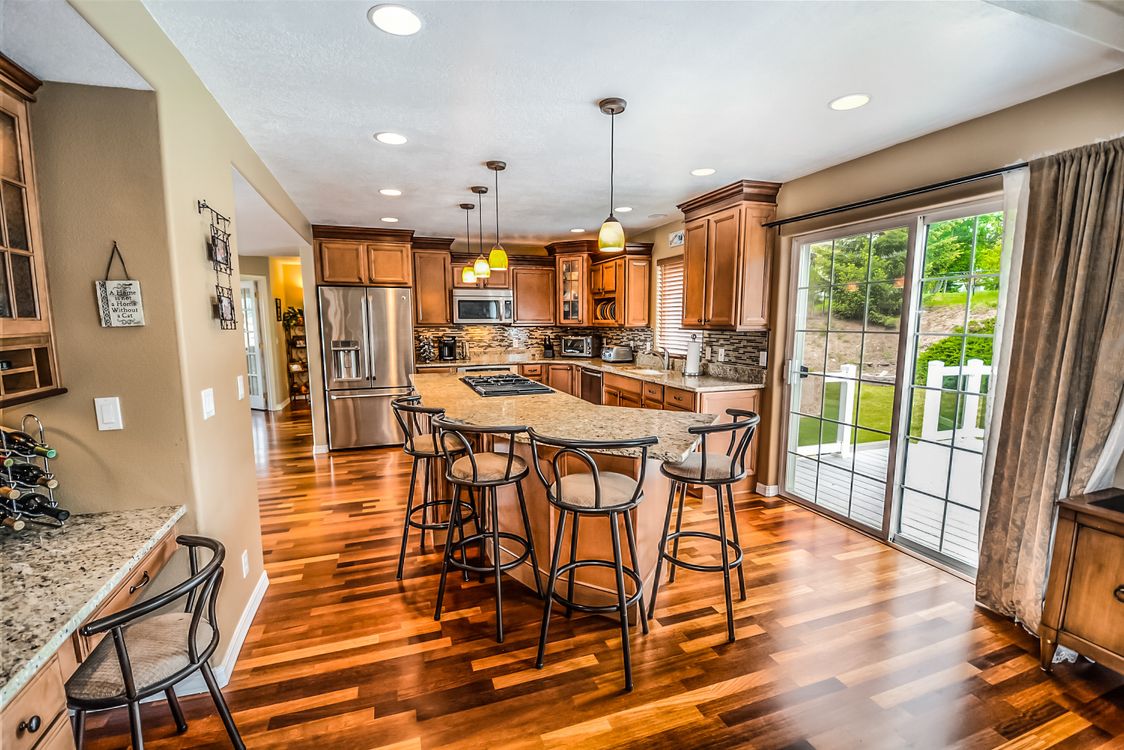 Modern kitchen island with bar stools in a bright contemporary home interior