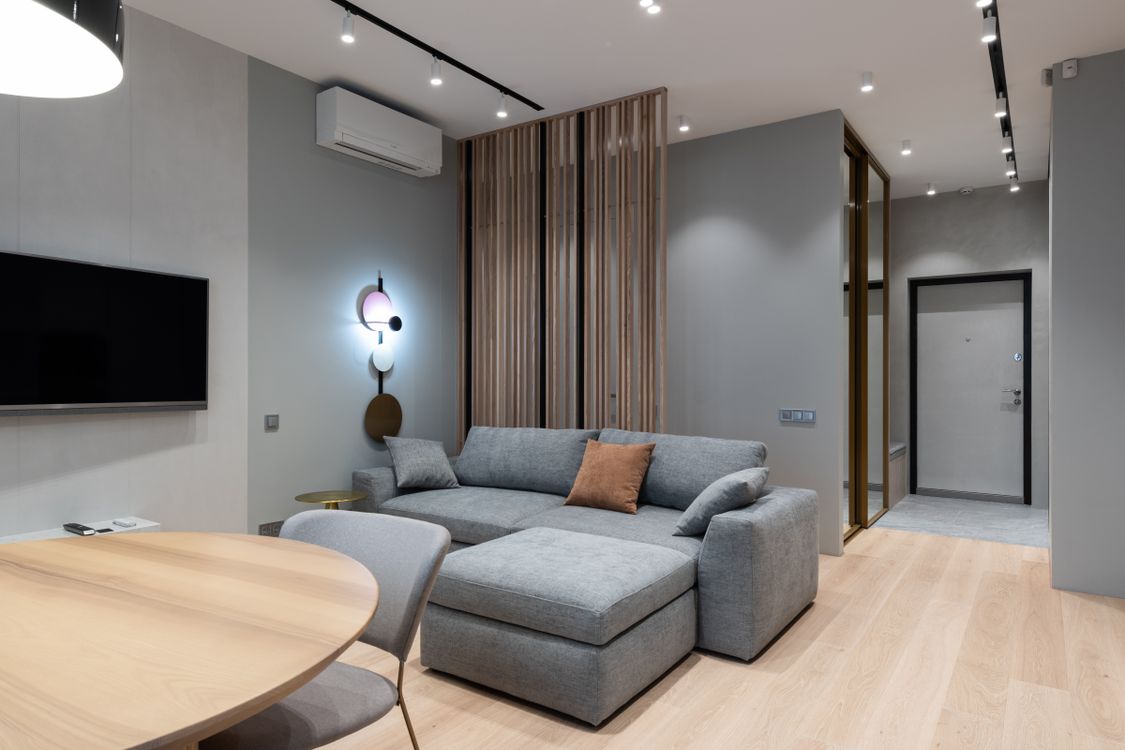 Modern living room with a gray sofa and contemporary furniture arrangement