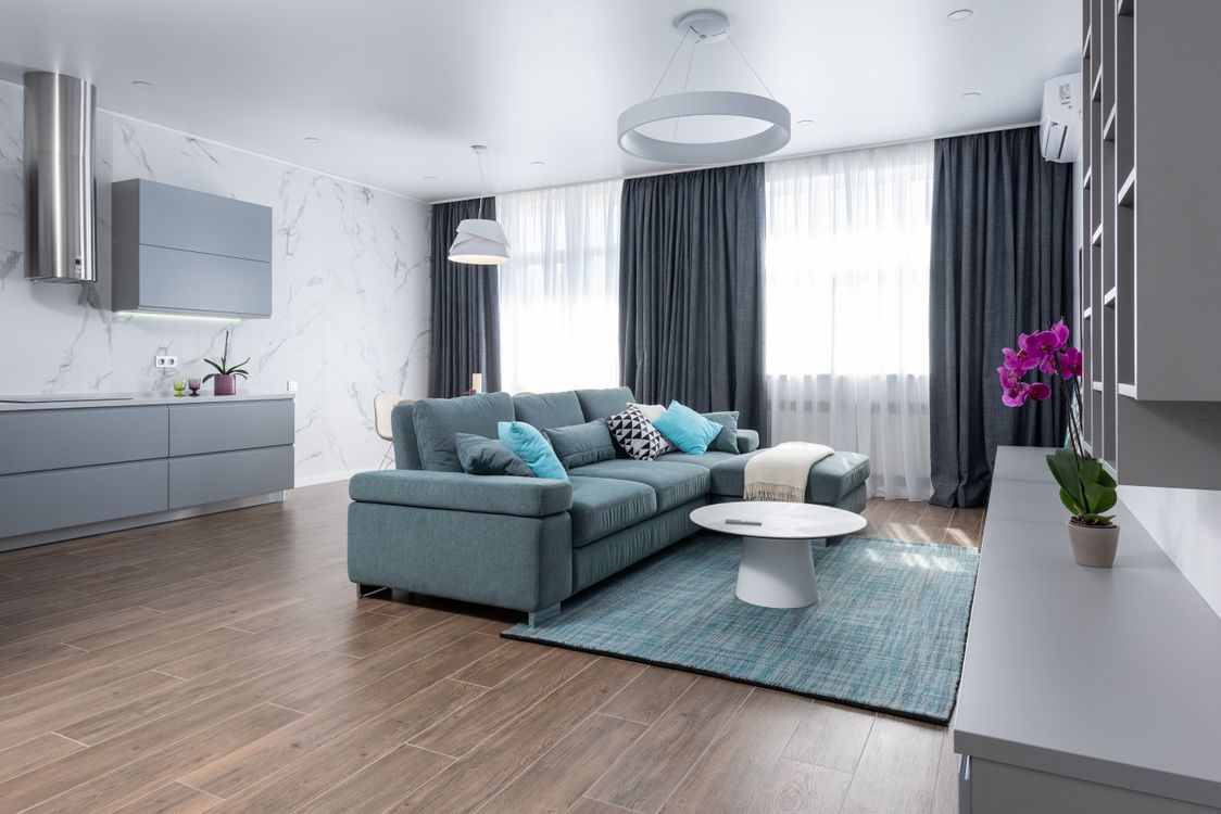 A spacious modern living room featuring a comfortable sofa and open contemporary layout