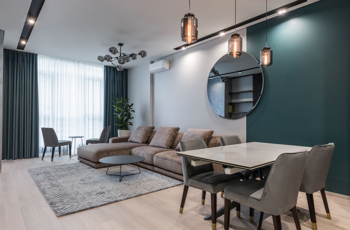 Contemporary interior showing a sofa and dining chairs in a modern home