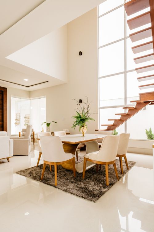 Spacious modern living room with minimalist wooden details and large windows