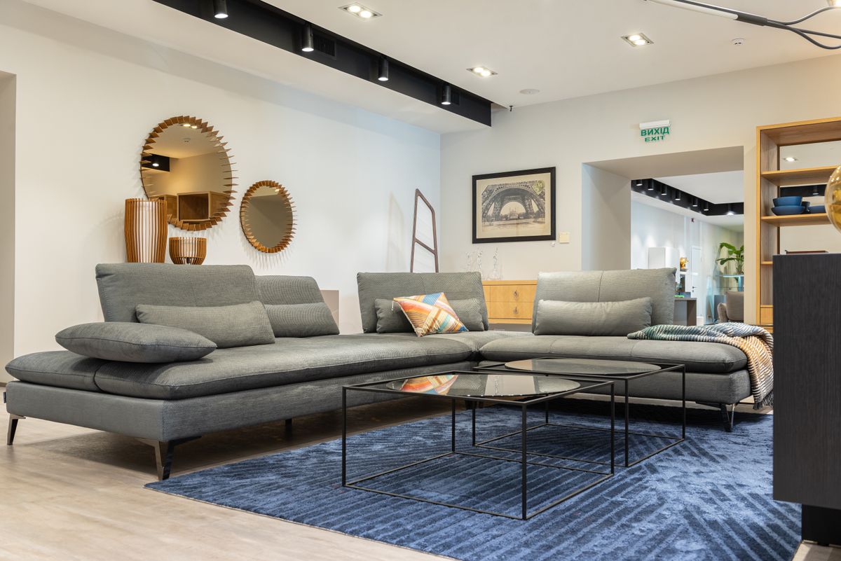 Modern living room interior with a sectional sofa and minimalist decor