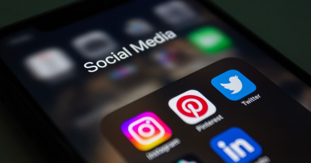 Smartphone screen showing a folder of social media app icons