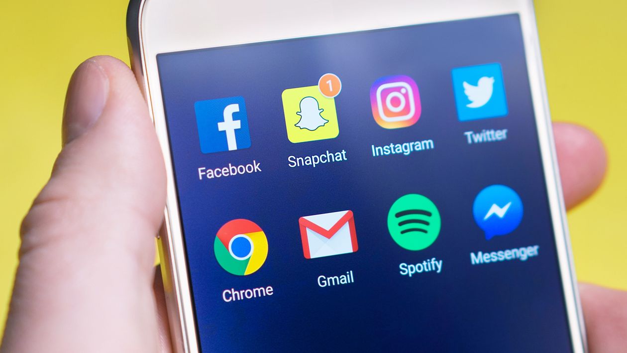 Smartphone showing social media apps on the home screen