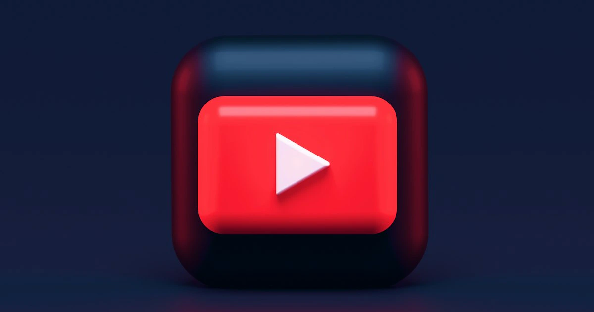 Red YouTube play button icon on a dark background representing channel growth