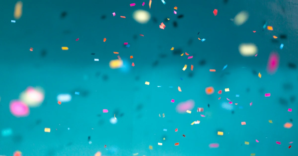 Colorful confetti and party decorations creating a festive celebration atmosphere