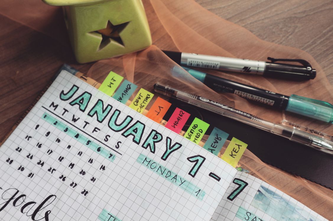 A planner and calendar used for tracking event details