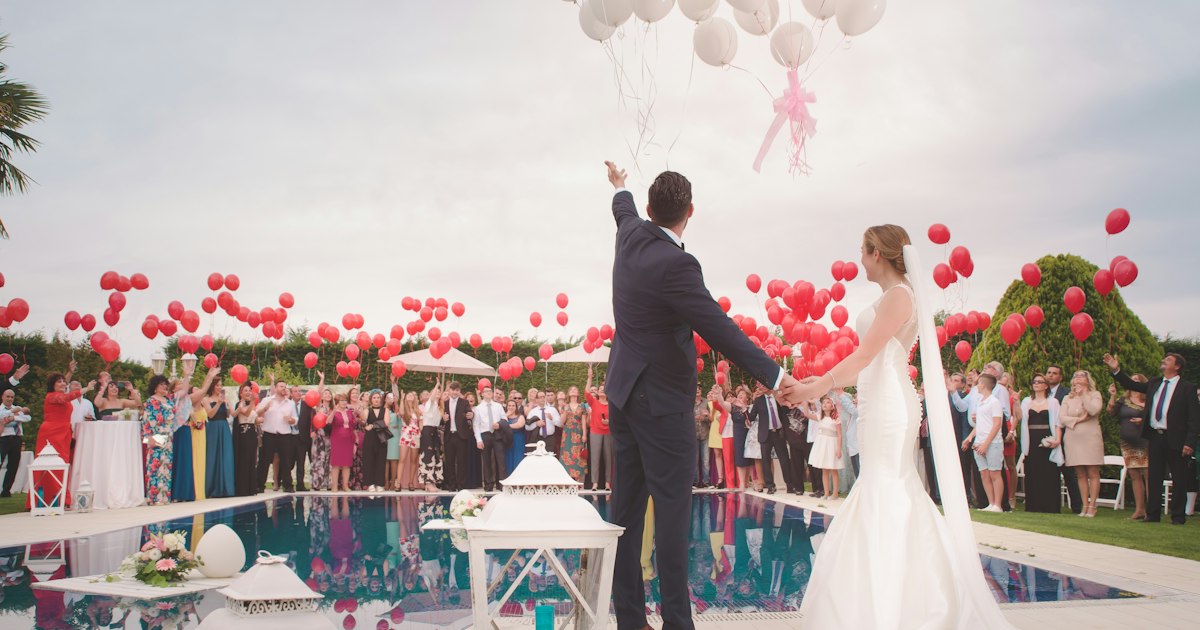 Elegant wedding celebration with guests toasting together
