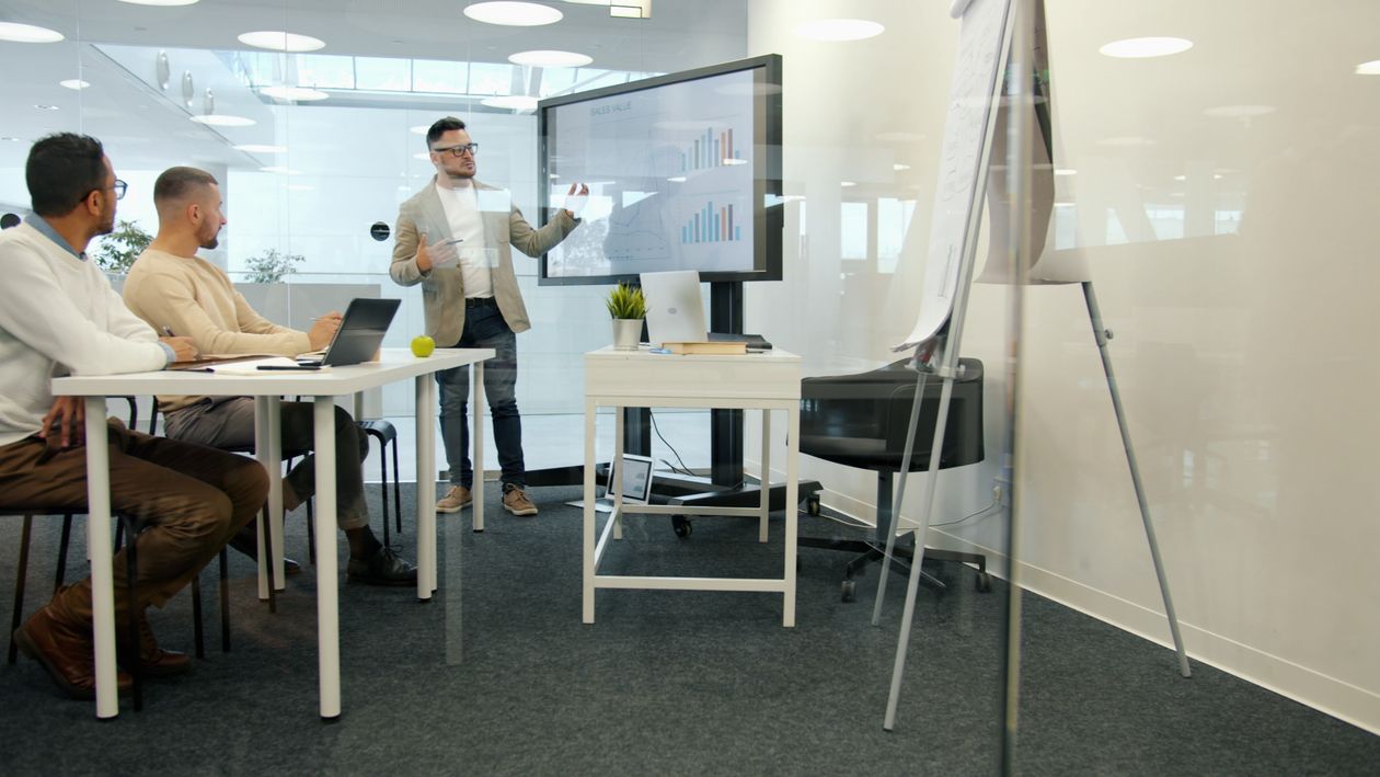 Business operations team reviewing workflow data in a modern office