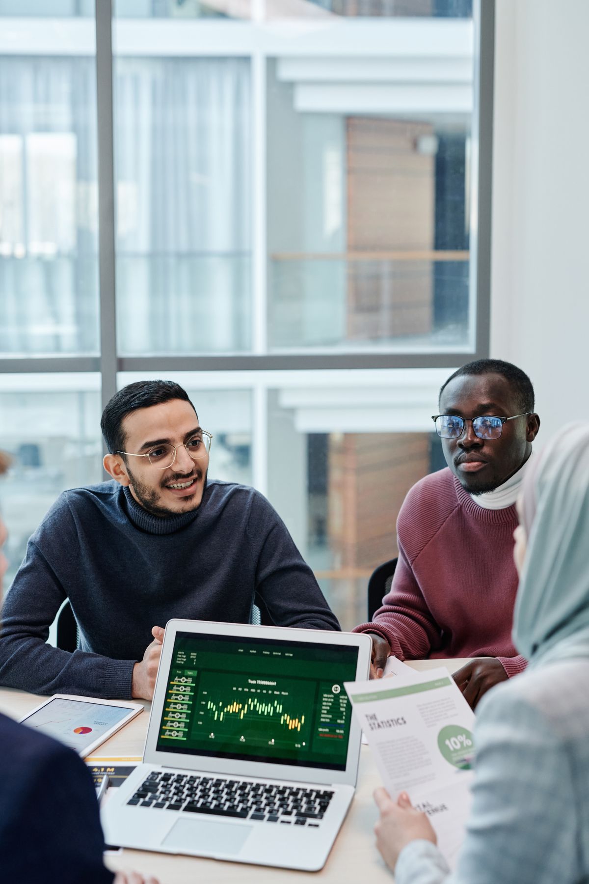 Cross-functional team reviewing business analytics in a modern office setting