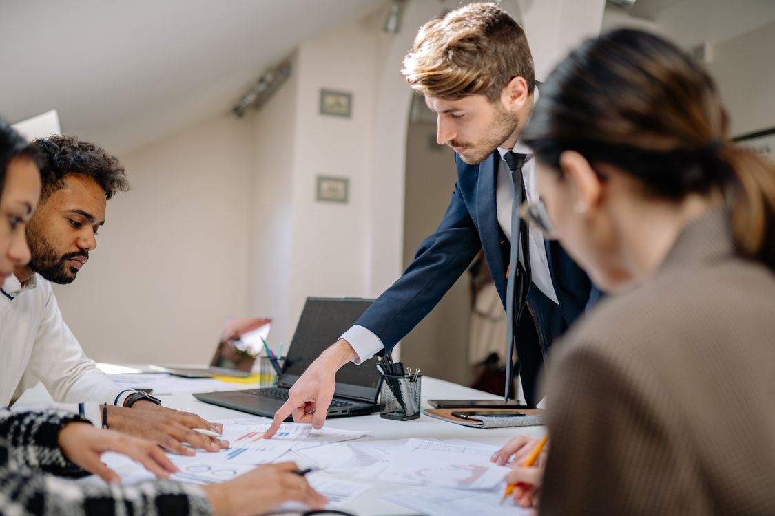 Business team collaborating on a project in a modern office