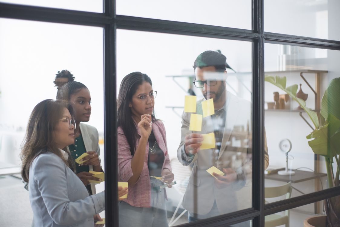 Business professionals in a collaborative planning session with notes