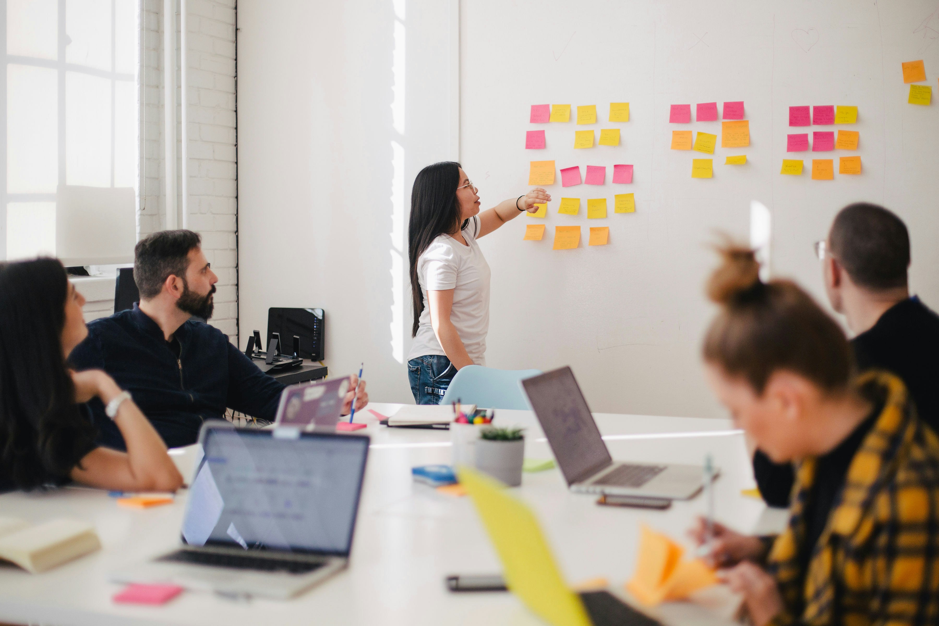 Operations team reviewing pending approvals during an office meeting