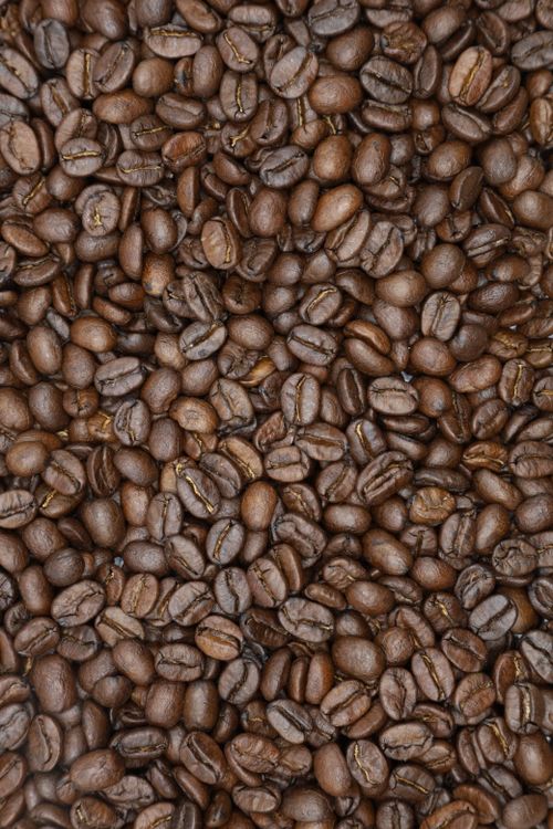 Overhead view of a pile of freshly roasted coffee beans
