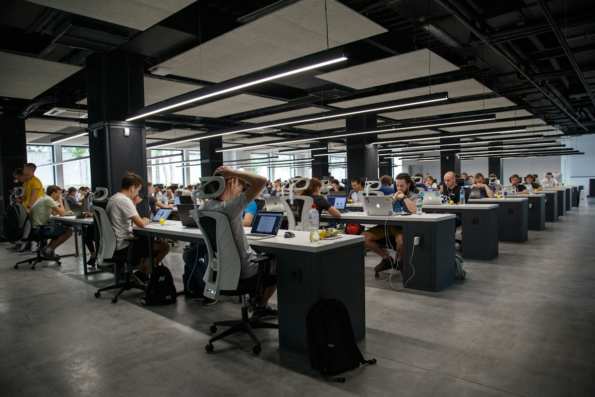 Contemporary co-working space with modern office furniture and natural lighting