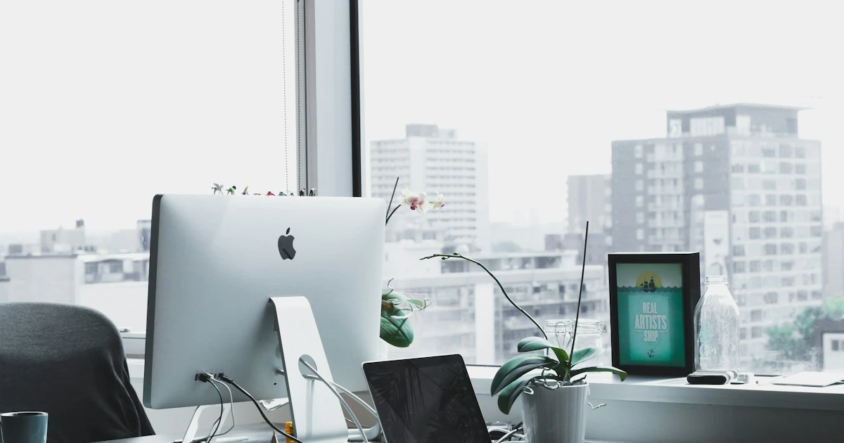 Clean modern office workspace with an ergonomic chair at a desk