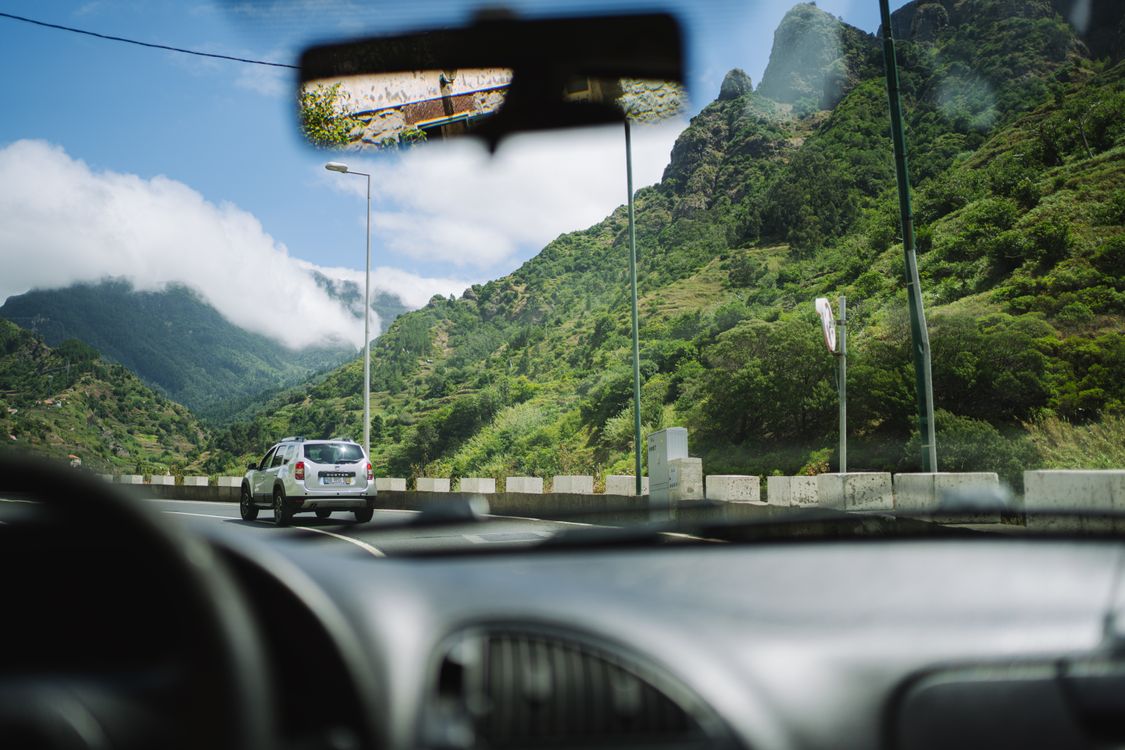 View through a windshield of a rental car on a scenic Costa Rican road