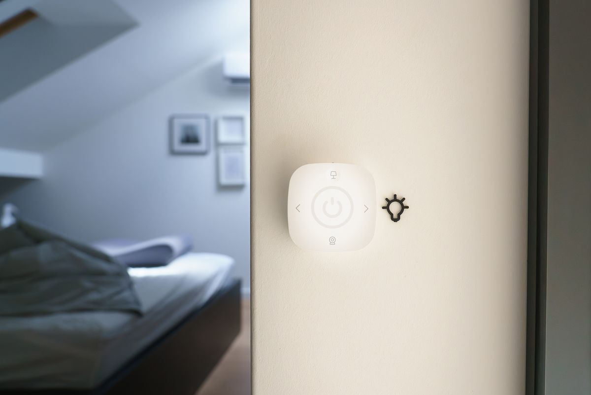 Modern smart room wall button panel for controlling lighting and automation in a minimalist hotel room