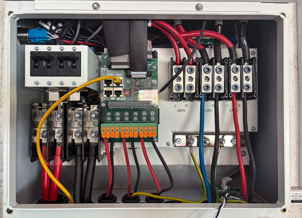 Detailed interior view of a building automation control panel showing organized circuits, wiring, and connection modules