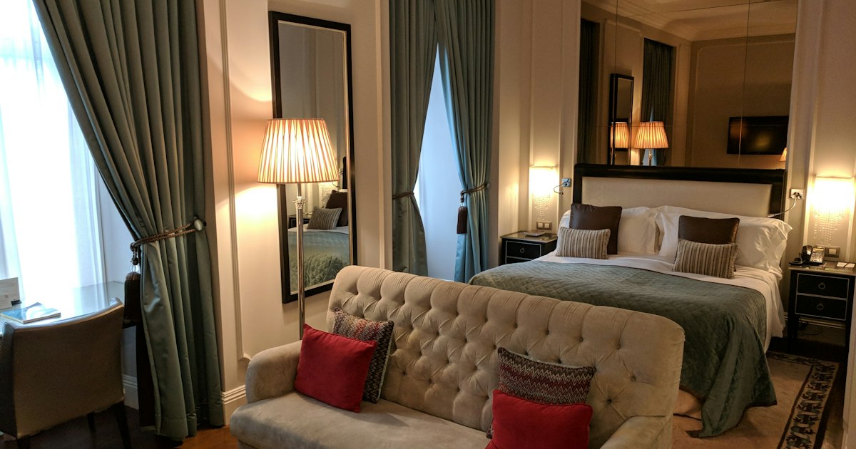Luxury hotel room with king bed and contemporary furnishings